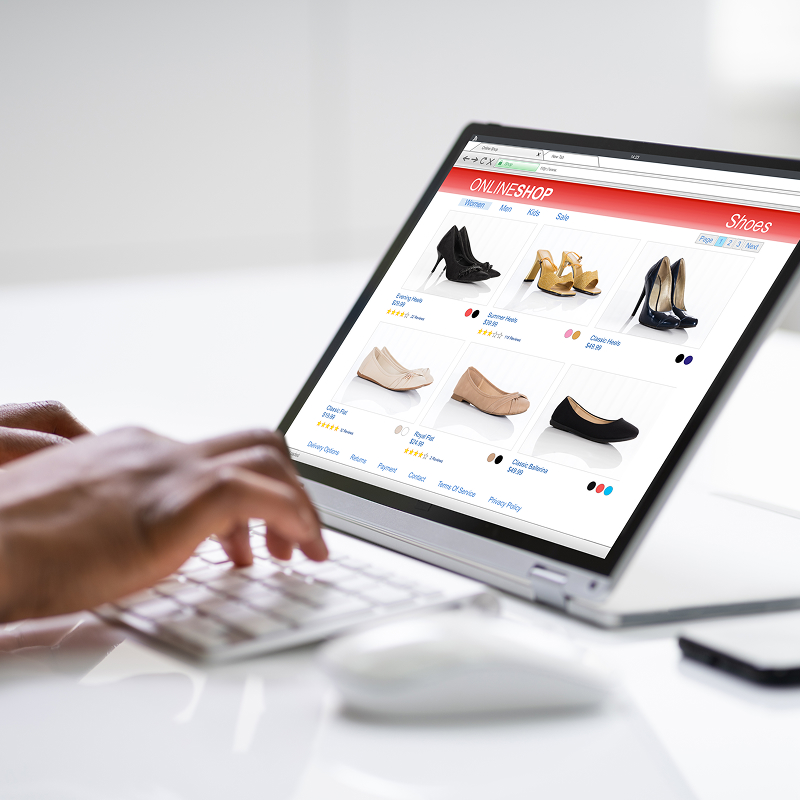 Woman shopping on convertible laptop