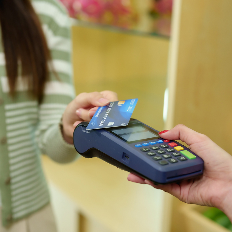 Pay with credit cards at fruit shop with small business owners contactless payment
